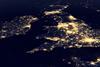 United Kingdom at night in the earth planet rotating from space