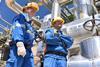 chemical industry plant - workers in work clothes