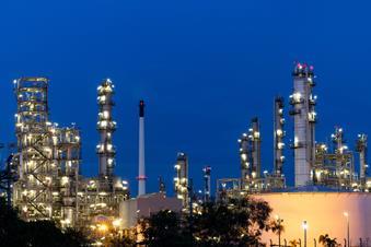 Oil and gas refinery plant firm industry zone at night.