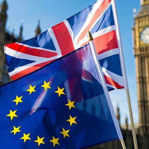 European Union and British Union Jack flag flying in front of Big Ben and the Houses of Parliament